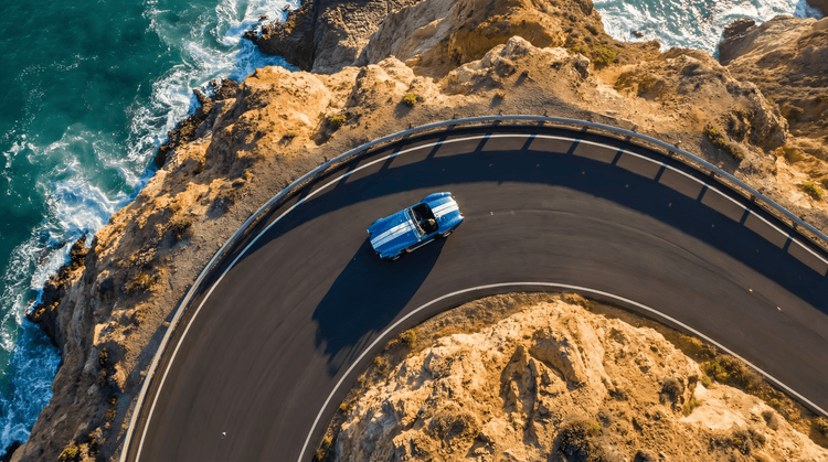 Coastal Curve: Shelby Cobra Aerial Pursuit