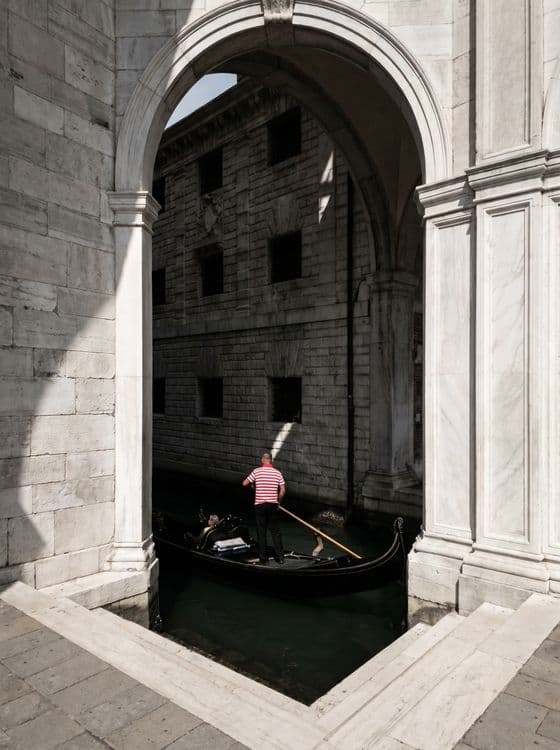 Through the Arch: Venice Gondolier Portrait